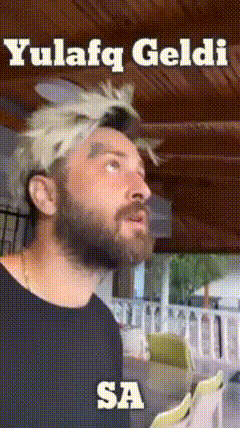 a man with a beard is wearing a headband that says yulefq geldi sa on it