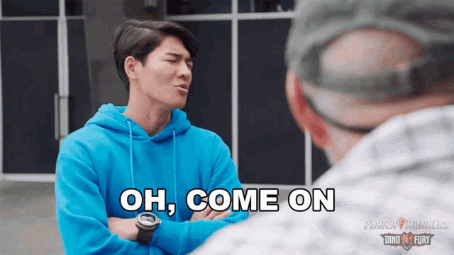 a man in a blue power rangers sweatshirt says oh come on
