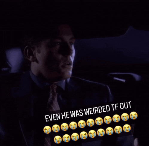 a man in a suit and tie is sitting in a car with a caption that says " even he was weirded tf out