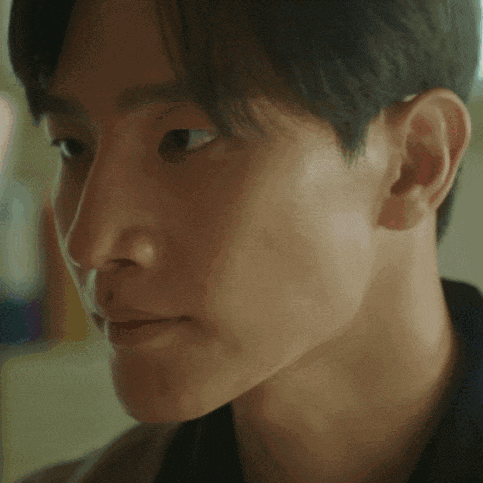 a close up of a person 's face with a blurred background