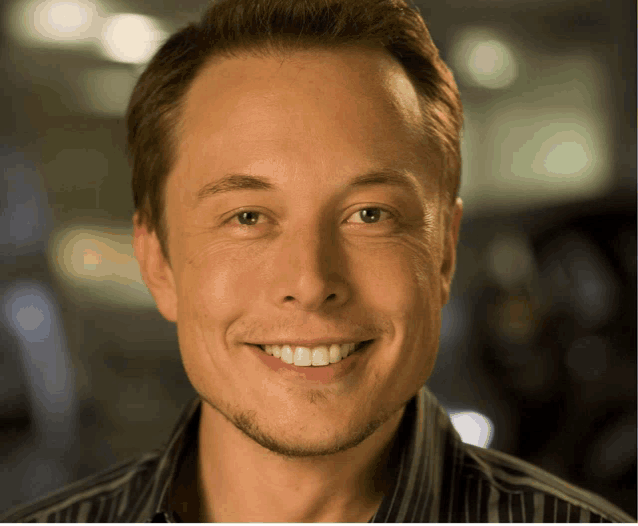 a close up of a man 's face with a smile on it