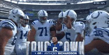 a group of indianapolis colts players are huddled together