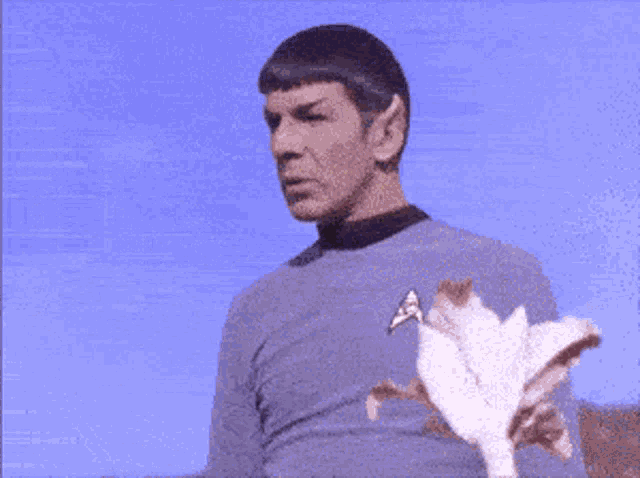a man in a star trek uniform is blowing bubbles with the words happy birthday