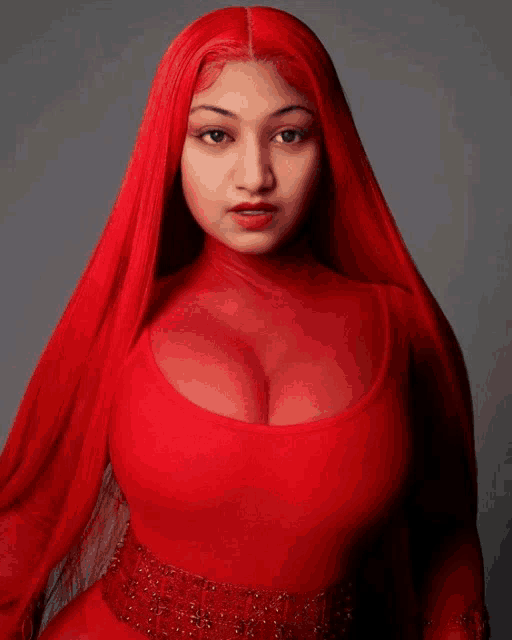 a woman with red hair and a red dress