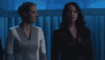 two women are standing next to each other and the words well this is a little awkward are visible