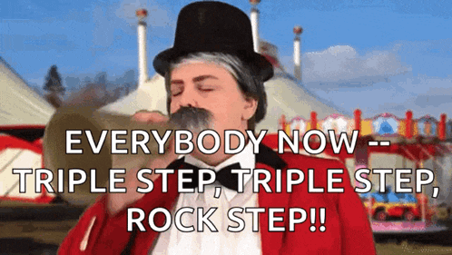 a man in a top hat and a red jacket says everybody now triple step triple step rock step