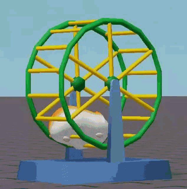a hamster is sitting in a ferris wheel on a blue base .