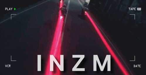 a video of people riding motorcycles in a tunnel with the word inzm at the bottom