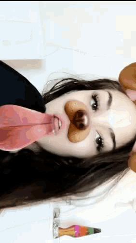 a woman wearing a dog face mask with her tongue sticking out