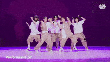 a group of people are dancing in front of a performance 37 banner