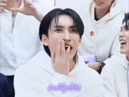 a man covering his mouth with his hand and the words amlilyedits written on the bottom