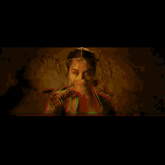 a woman is standing in front of a circular design on the wall
