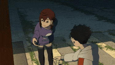 a girl wearing a purple shirt that says s.o.a.n.d. is standing next to a boy