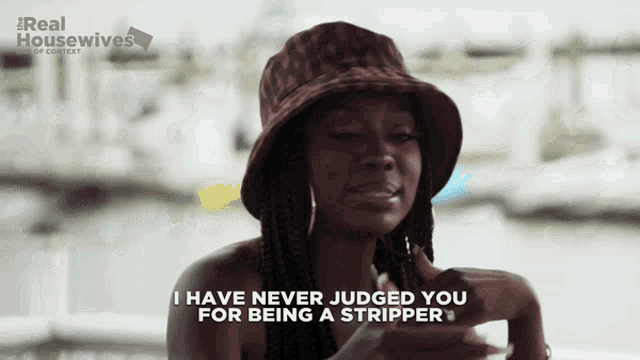 a woman in a bucket hat says i have never judged you for being a stripper