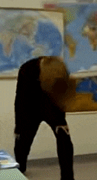 a blurry picture of a person standing in front of a map of the world