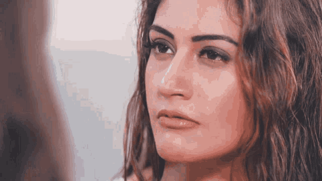 a woman with a serious look on her face