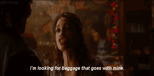 a woman is looking for baggage that goes with mine
