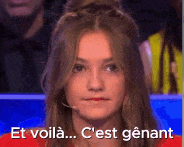 a girl with a microphone on her head says et voila ... c'est genant