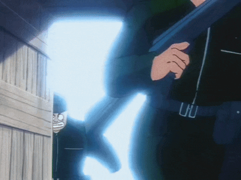 a man in a black shirt is holding a gun