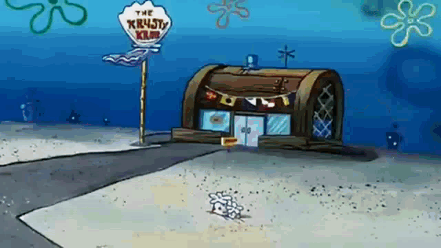 a cartoon of a krusty krab restaurant in the sand