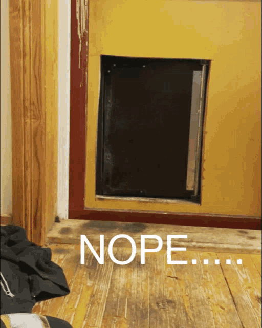 a picture of a dog door with the word nope written below it