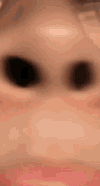 a close up of a person 's nose and eyes with glasses