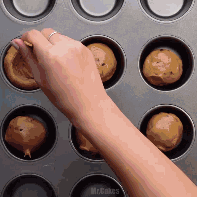 a muffin pan with the word mr.cakes written on it