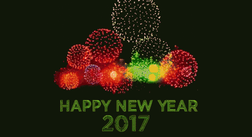 a happy new year 2017 greeting card with fireworks behind it