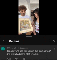 a man and a woman are holding a painting in their hands while a person says " replies " at the bottom