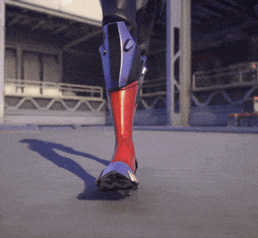 a close up of a person 's leg with a red and purple boot
