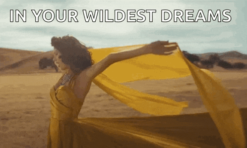 a woman in a yellow dress is dancing in the desert with the words in your wildest dreams written above her