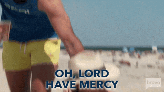 a man walking on a beach with the words oh lord have mercy
