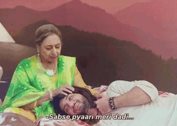 a man laying on a bed with a woman putting her hand on his head and a caption that says sabse pyaari meri dadi