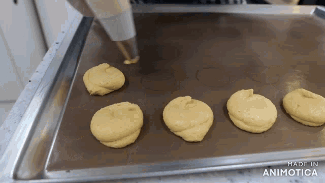 a bunch of cookies on a baking sheet that says made in animotica