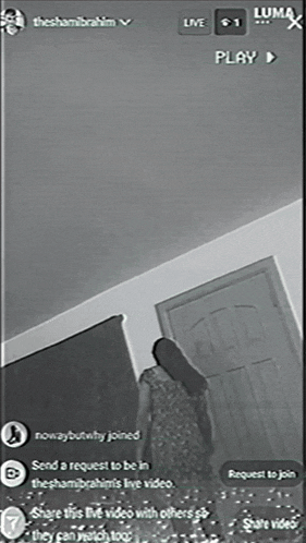 a black and white photo of a woman standing in a room with the name theshamibrahim on it
