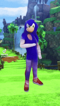a sonic the hedgehog mascot is standing in a green field