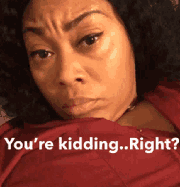 a woman in a red shirt with the words " you 're kidding right " on the bottom