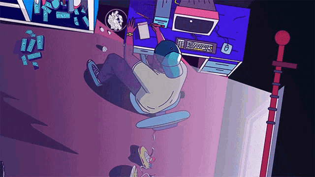 an aerial view of a person sitting at a desk with a computer and a bowl of popcorn