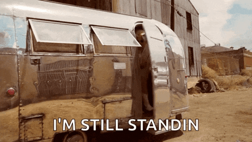 a silver trailer with the words i 'm still standin on the bottom