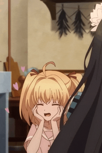 a girl with blonde hair is smiling with her hands on her face