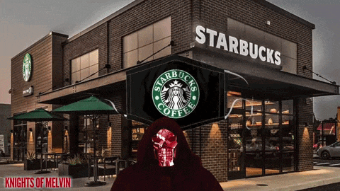 a man in a red hood is standing in front of a starbucks coffee shop