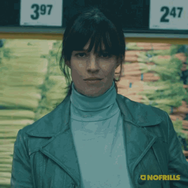 a woman standing in front of a sign that says 397