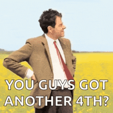 a man in a suit and tie is standing in a field of yellow flowers and says you guys got another 4th