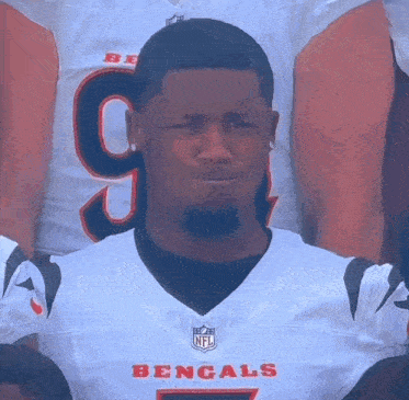 a man wearing a bengals jersey with the number 9 on the front