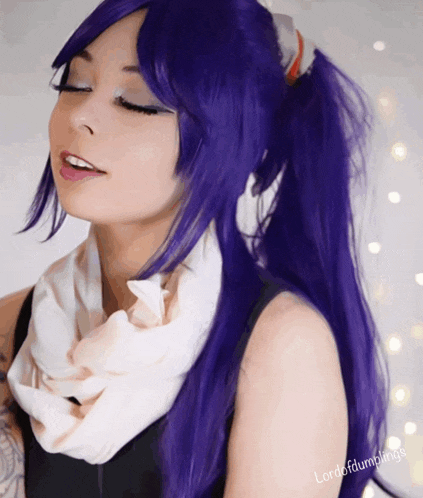a woman with purple hair has lordofdumplings written on the bottom right