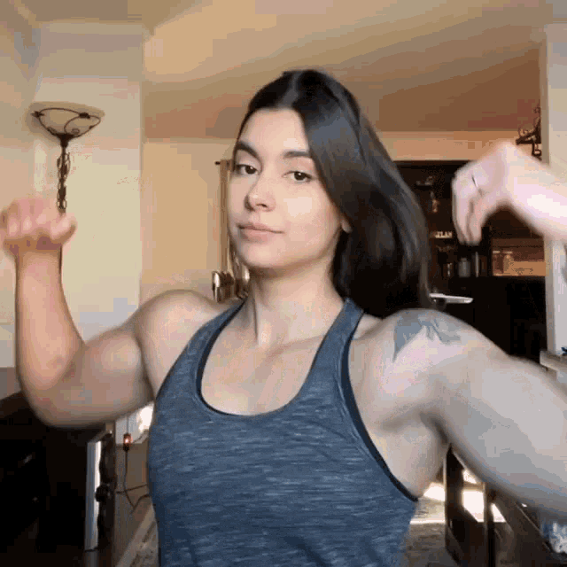 Girl Flexing Female Bodybuilder GIF