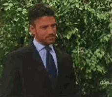 a man in a suit and tie stands in front of trees and says do you feel safe
