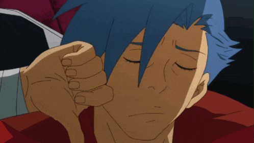 a man with blue hair has his eyes closed and a fist on his face