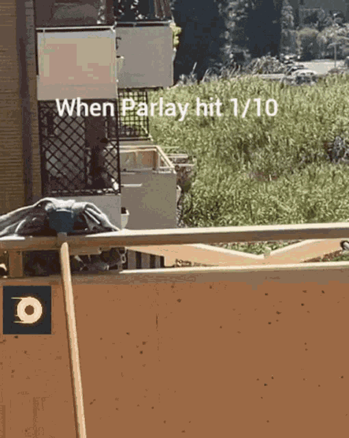 a sign that says when parlay hit 1/10 is on a balcony