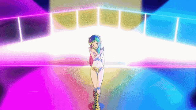 a girl in a bikini is standing on a stage in front of a colorful background .